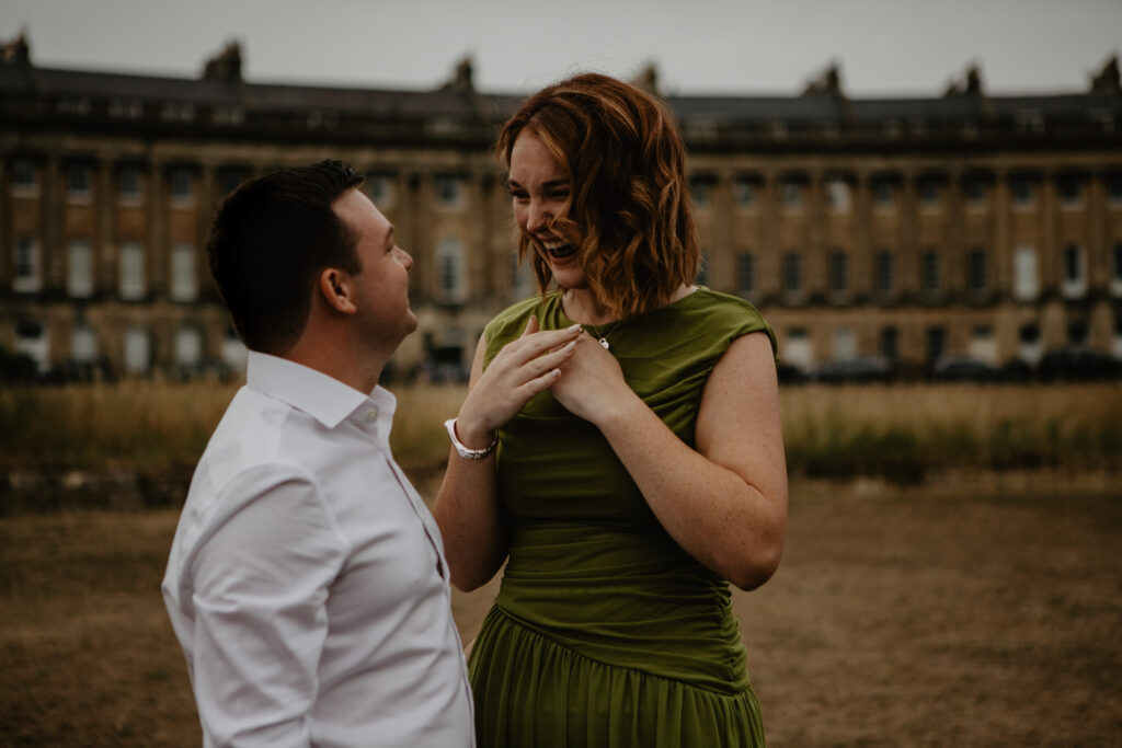 a couple in shock after a surprise proposal in bath 