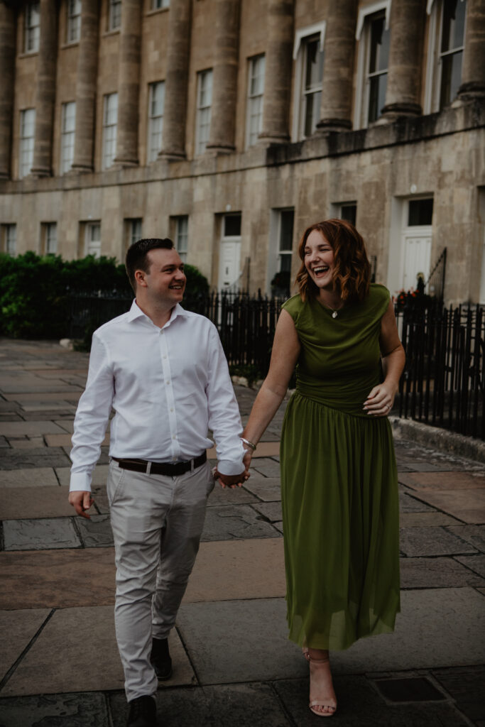 a couple candidly laughing during a proposal photoshoot
