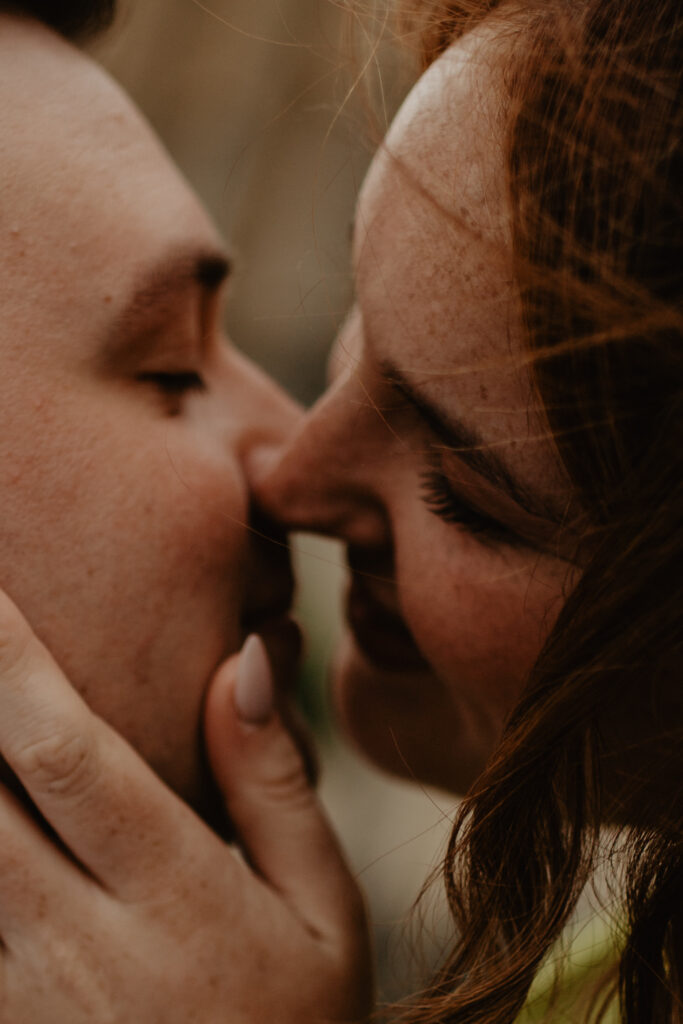 a couple kissing during a couple photoshoot 