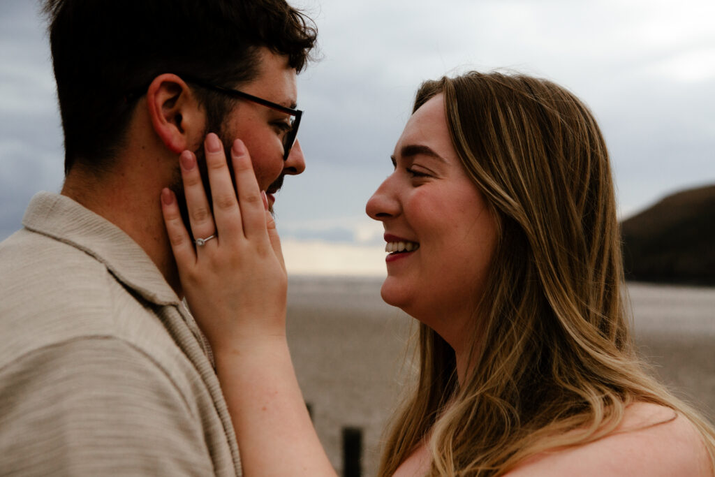 a couple during an engagement photoshoot on brean beach in somerset