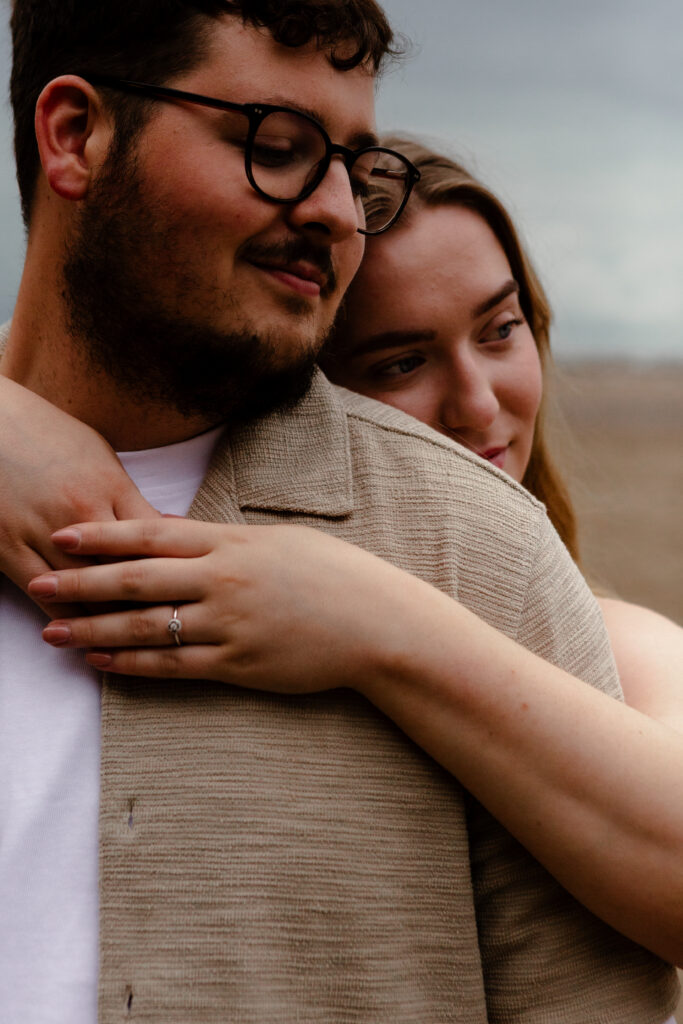 a couple during an engagement photoshoot on brean beach in somerset